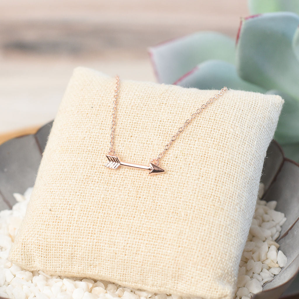 Arrow Pendant Necklace in silver, gold, and rose gold.